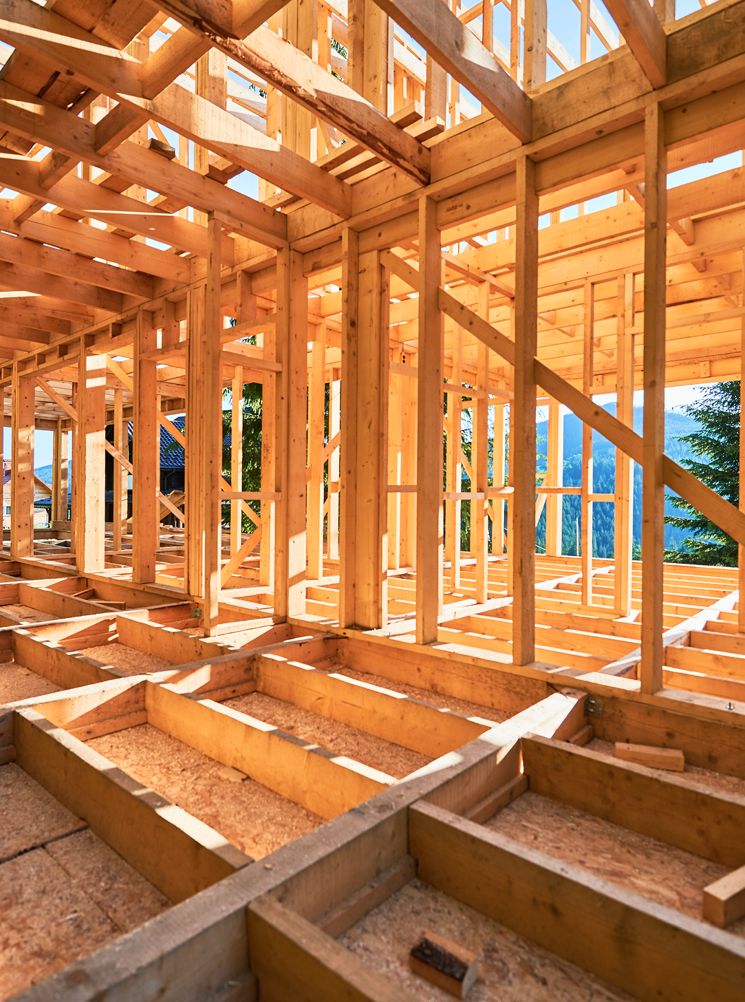 The inside of a wooden house under construction.