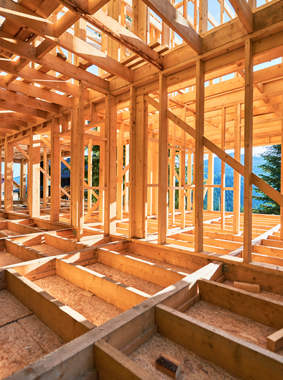 The inside of a wooden house under construction.