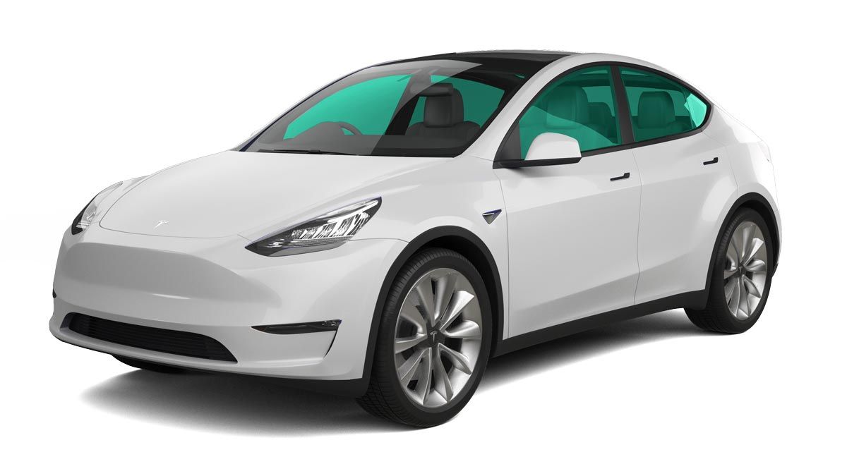 White Tesla Model Y with teal tinted windows.