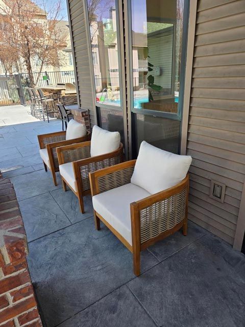 Three outdoor wooden chairs — Apartments for Rent Boise