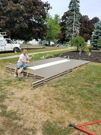 Worker Installing Sign — sign company in Albany, NY