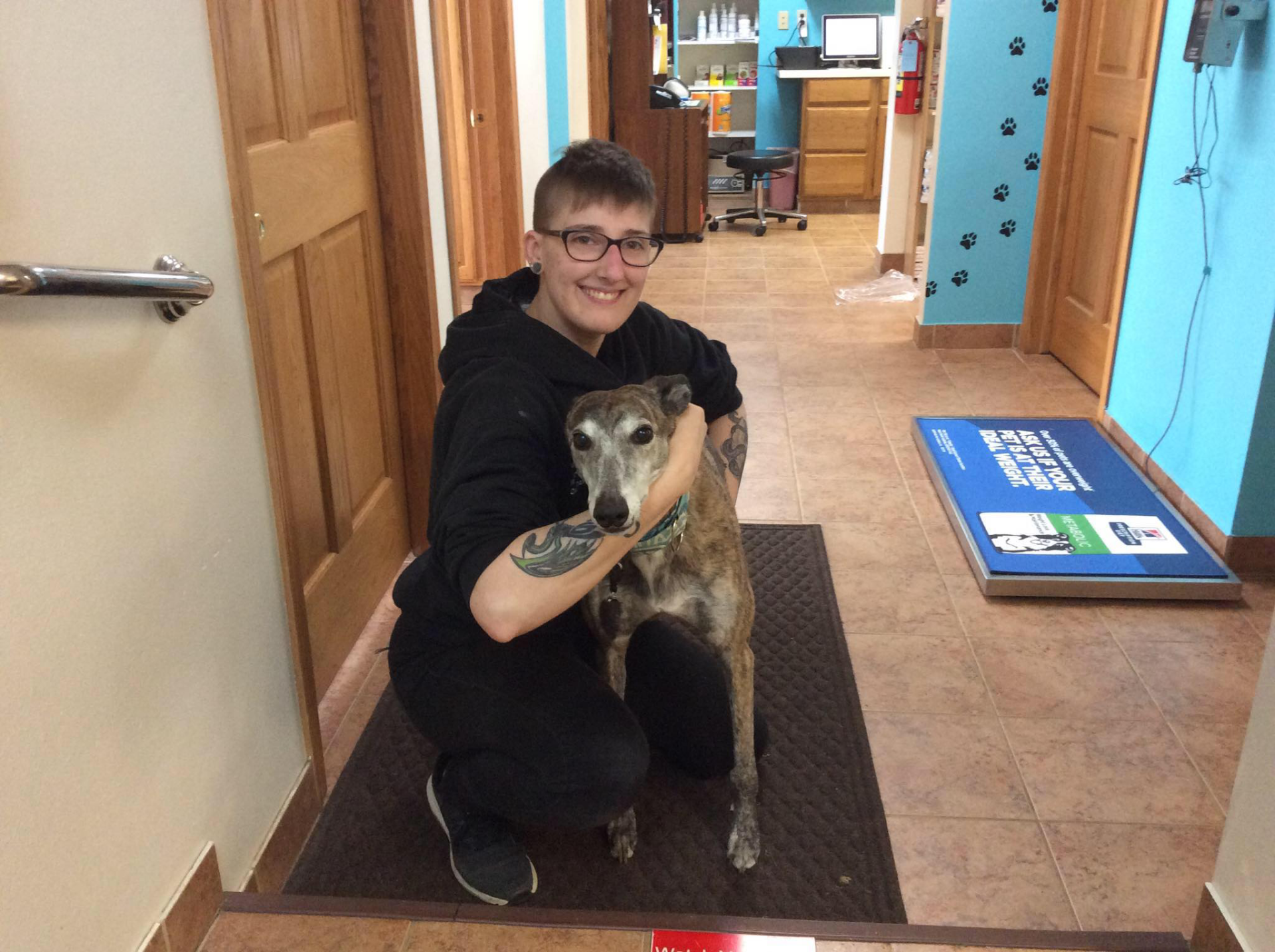 Veterinarian Hugging A Dog - Des Moines, IA - Hickman Road Veterinary Clinic