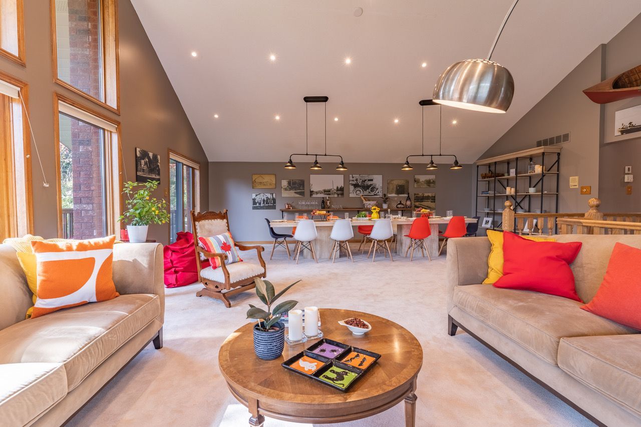 A living room with two couches and a round coffee table.