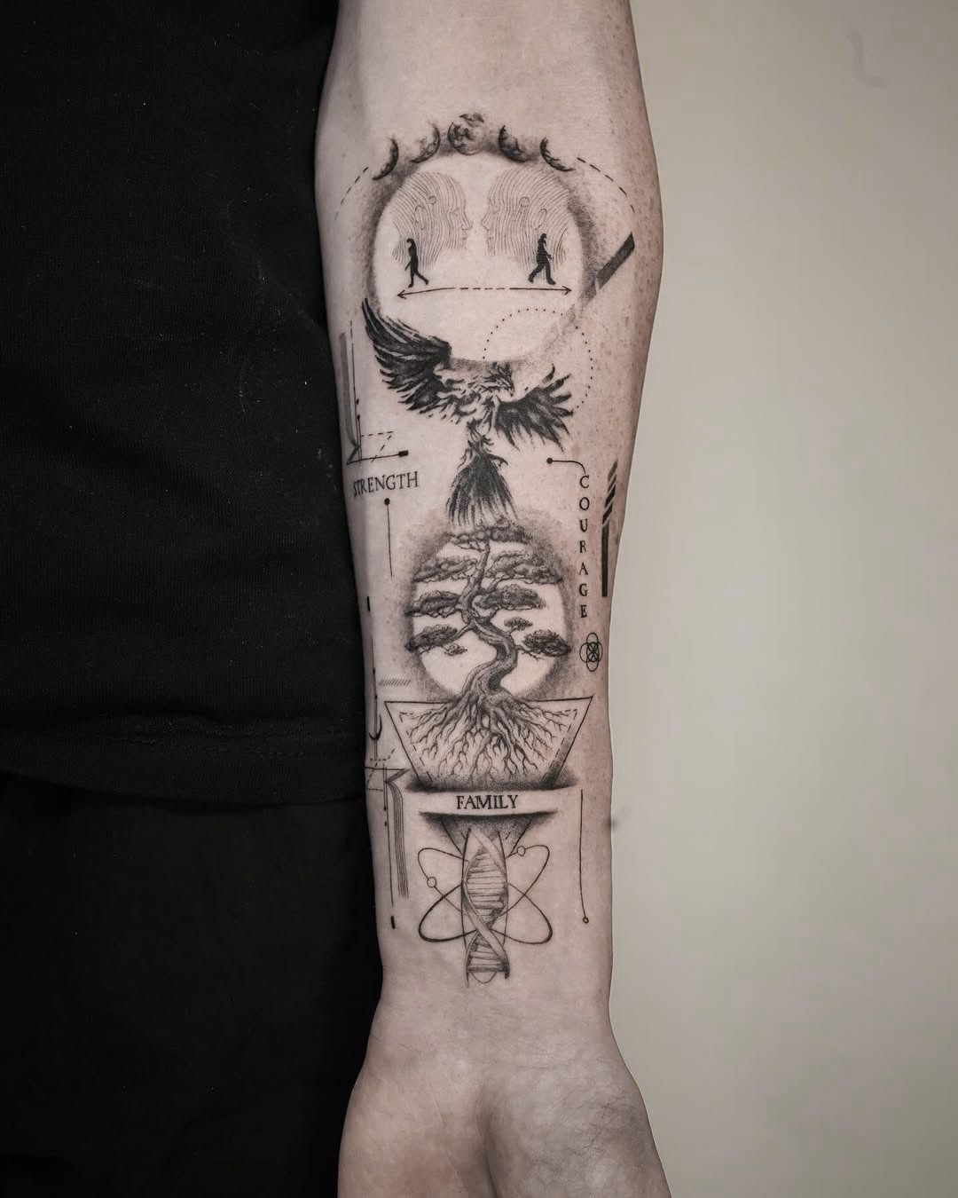 A detailed black-ink forearm tattoo featuring a bonsai tree, an atom symbol, a winged creature, and abstract silhouettes.