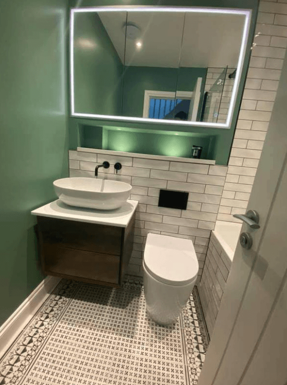 Picture of a new bathroom in with dark green walls by Plumbers Sheffield