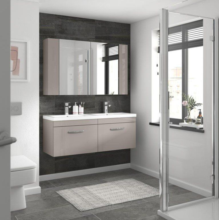 Picture of a new white bathroom suite with vanity unit and dark grey feature wall installed by plumbers Sheffield