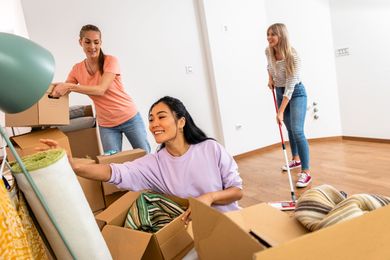 A group of women are moving into a new apartment.