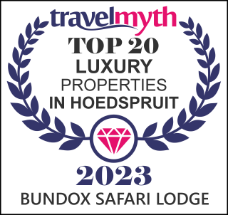 Travelmyth award: Top 20 Luxury Properties in Hoedspruit 2023. Bundox Safari Lodge highlighted, set within a wreath with a diamond.