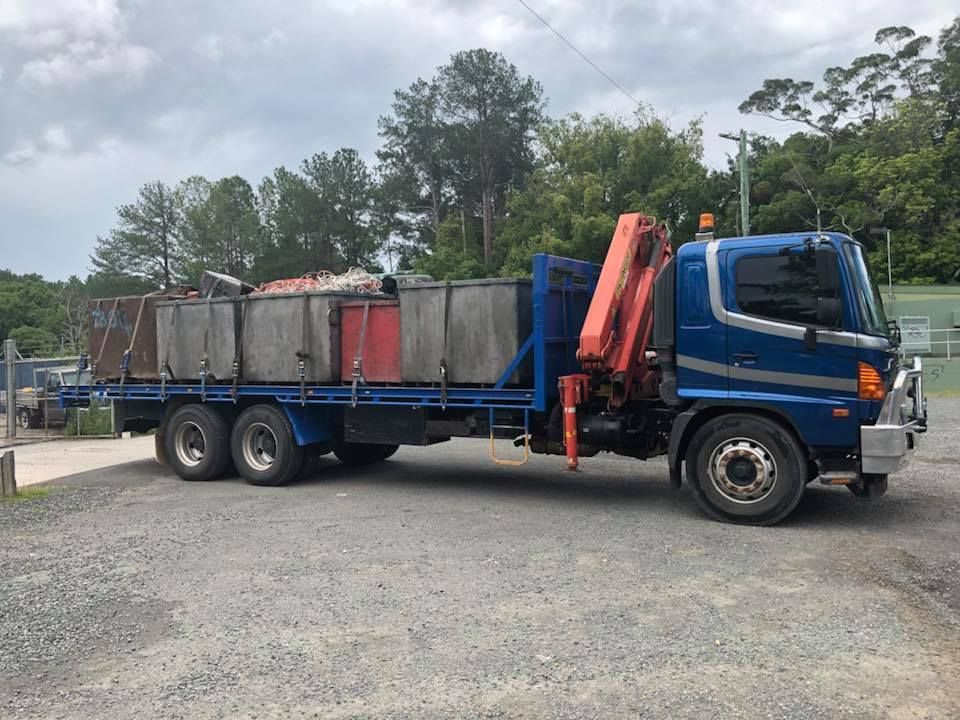 Blue Flatbed Truck With A Crane, Loaded With Containers, Parked Outside — H&H Metal Recycling in Moffat Beach, QLD