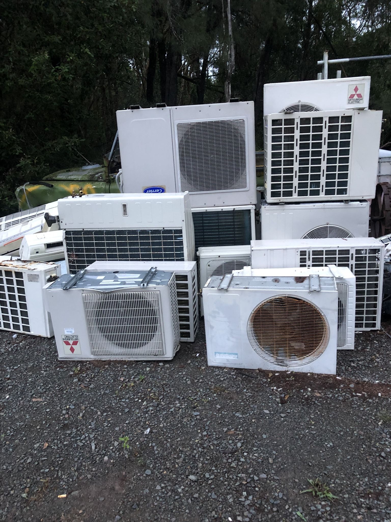 Pile Of Discarded Air Conditioning Units On Gravel, Outdoor Setting — H&H Metal Recycling in Kenilworth, QLD