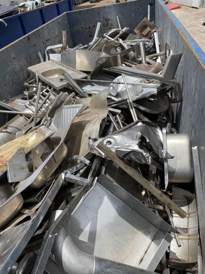 Scrap Metal Pile In A Large Blue Bin; Various Bent And Broken Silver Pieces — H&H Metal Recycling in Kenilworth, QLD