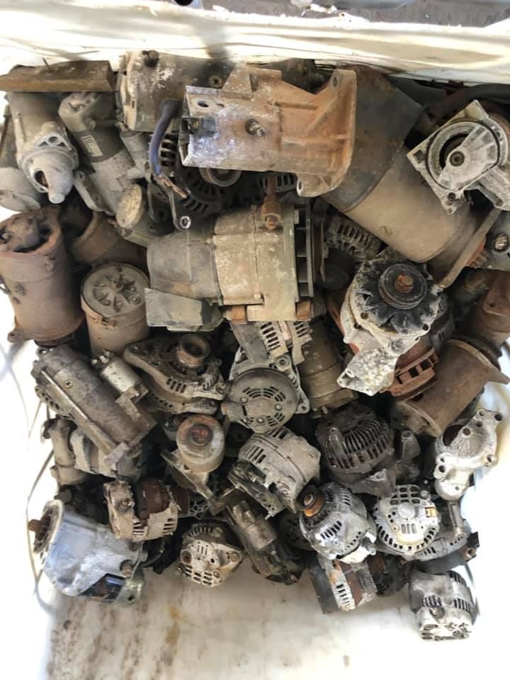 Pile Of Old, Weathered Alternators In A Plastic Bag, Likely For Recycling — H&H Metal Recycling in Maleny, QLD