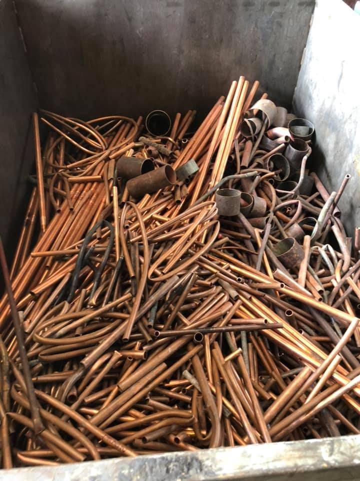Copper Pipes And Fittings In A Metal Container — H&H Metal Recycling in Maleny, QLD