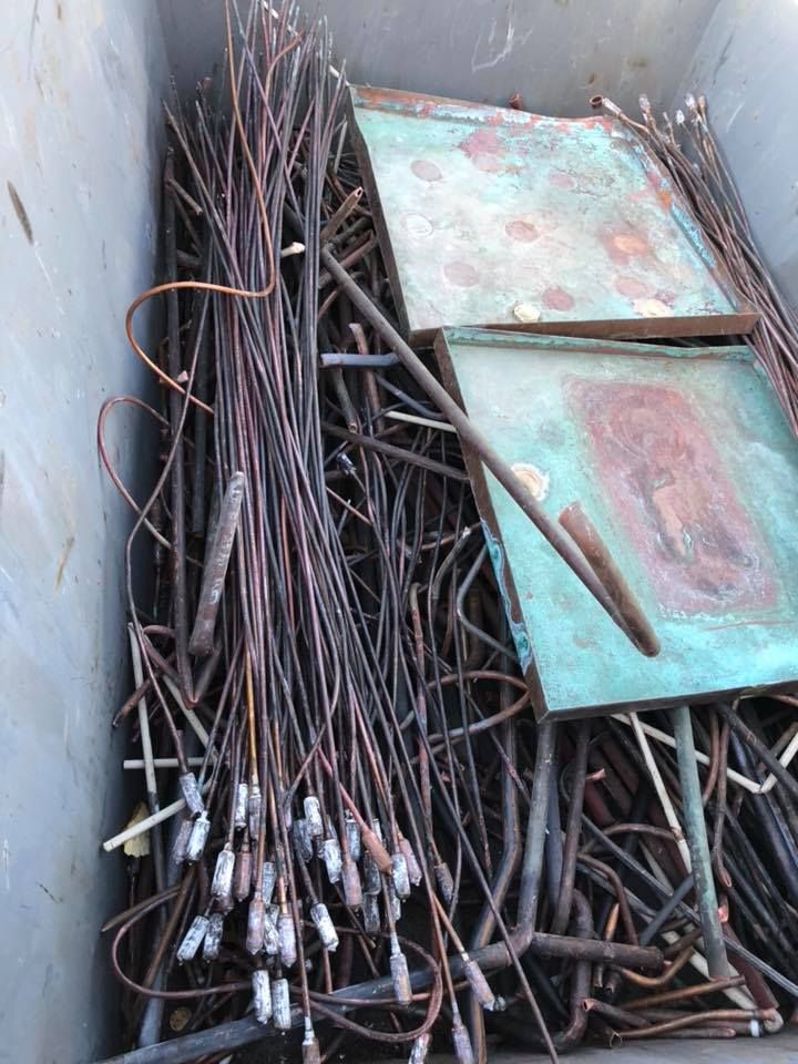 Pile Of Copper Tubing And Plates In A Container — H&H Metal Recycling in Moffat Beach, QLD