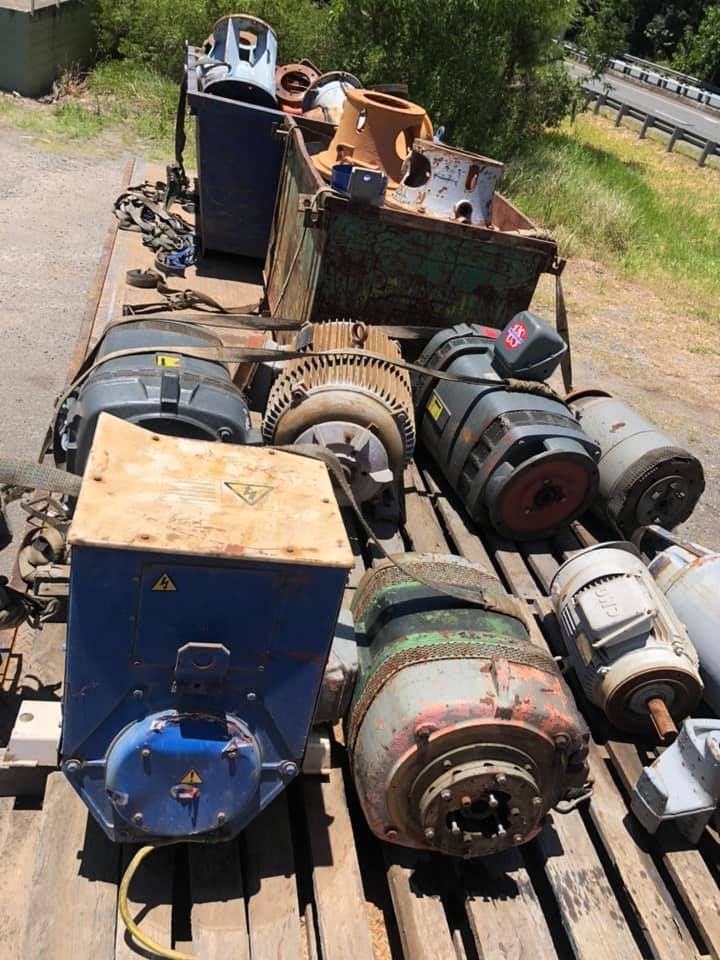 Various Electrical Motors And Equipment Loaded On A Flatbed Trailer — H&H Metal Recycling in Pelican Waters, QLD