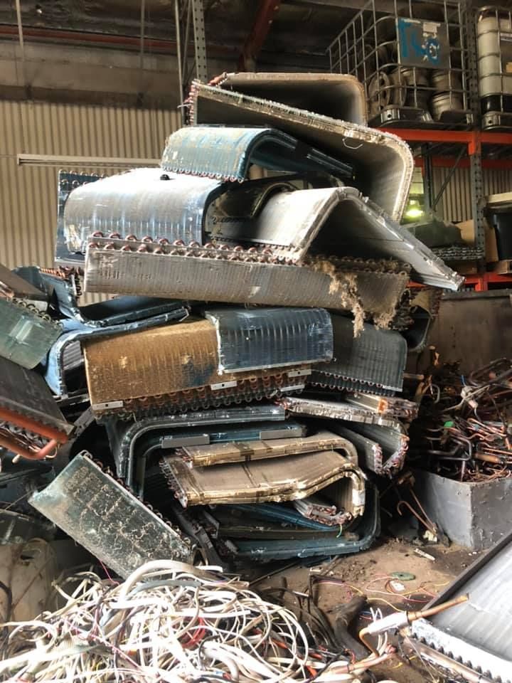 Pile Of Scrapped Air Conditioner Coils In A Warehouse — H&H Metal Recycling in Pelican Waters, QLD