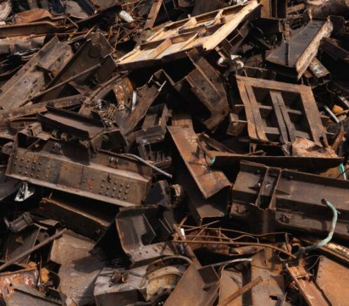 A Pile of Rusty Metal Is Sitting on The Ground — H & H Metal Recycling In Noosa, QLD