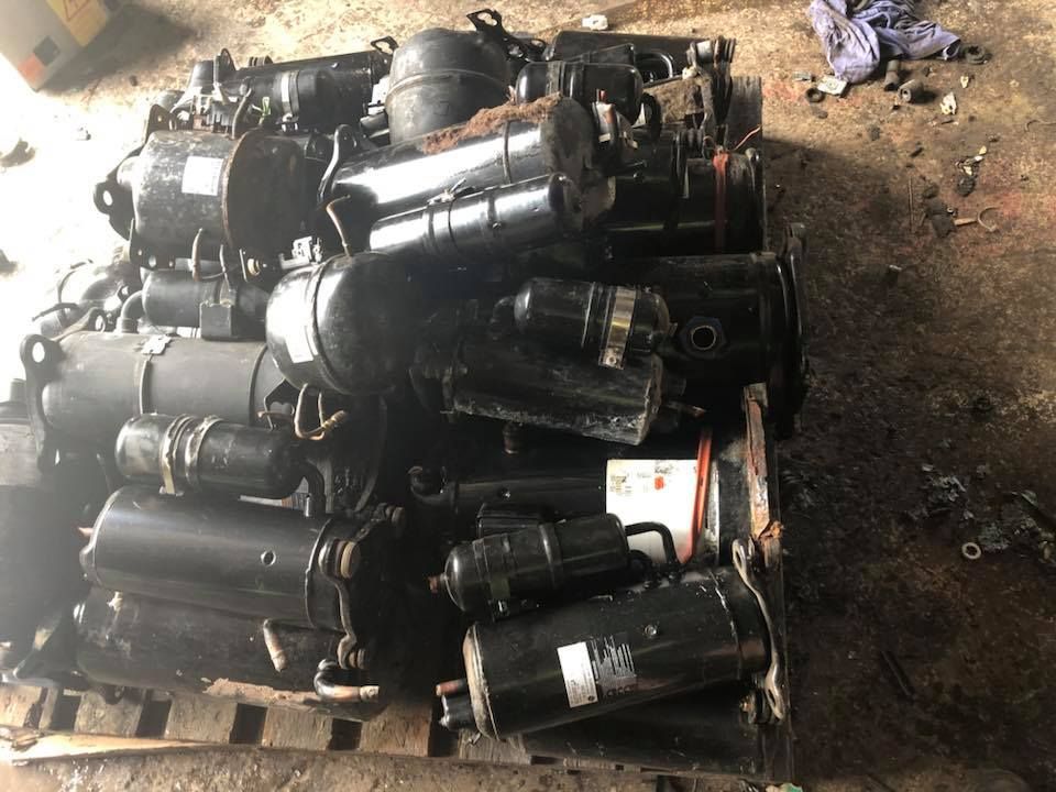 Pile Of Black Auto Parts On A Wooden Pallet — H&H Metal Recycling in Bells Creek, QLD