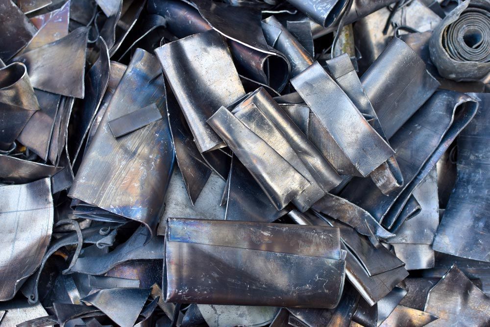 A Pile of Dark, Bent, and Discarded Metal Scraps — H&H Metal Recycling in Moffat Beach, QLD