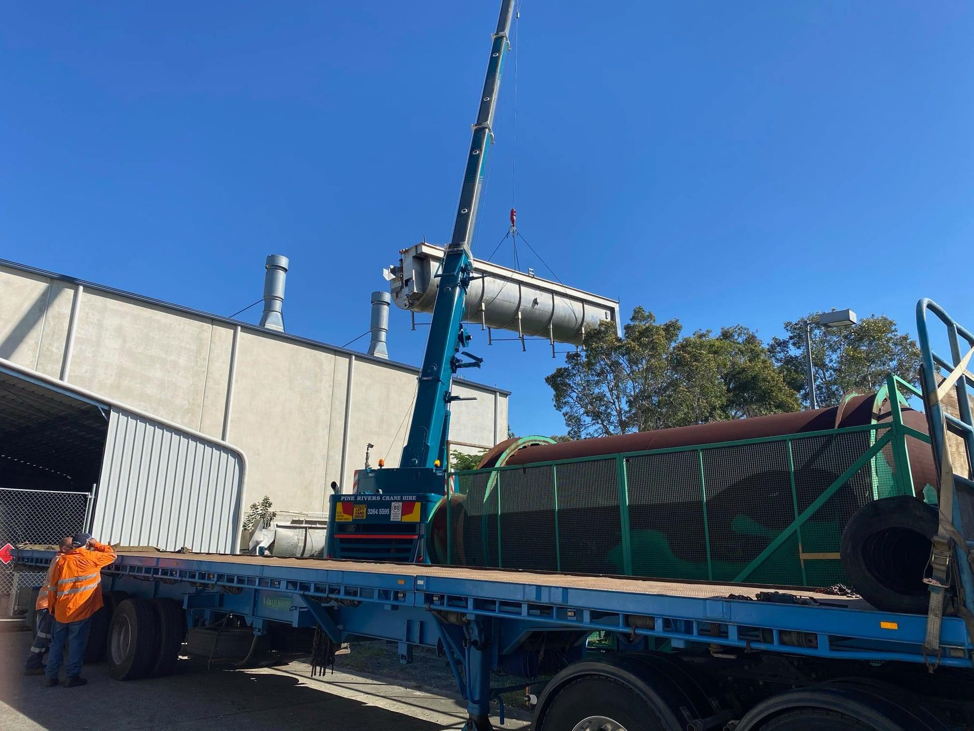 A Truck-mounted Crane Lifts a Large Industrial Tank — H&H Metal Recycling in Caloundra West, QLD