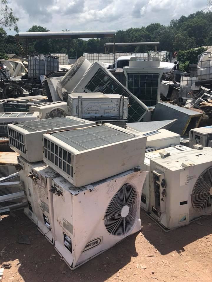 Pile Of Discarded Air Conditioning Units At A Salvage Yard — H&H Metal Recycling in Bells Creek, QLD
