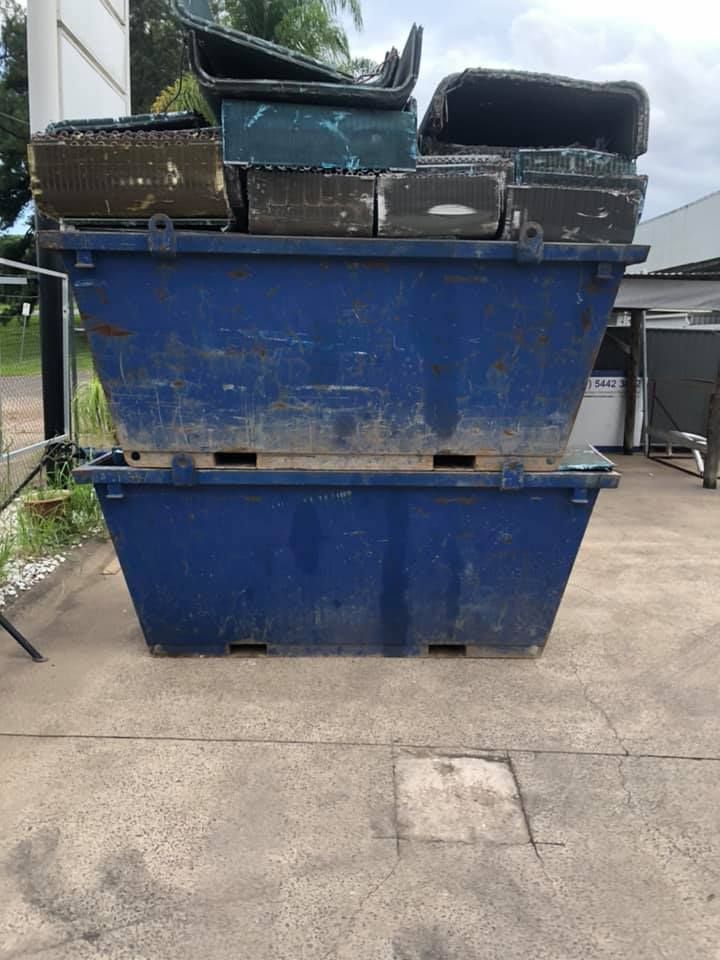 Two Stacked Blue Dumpsters With Various Containers On Top, Outdoors — H&H Metal Recycling in Bells Creek, QLD