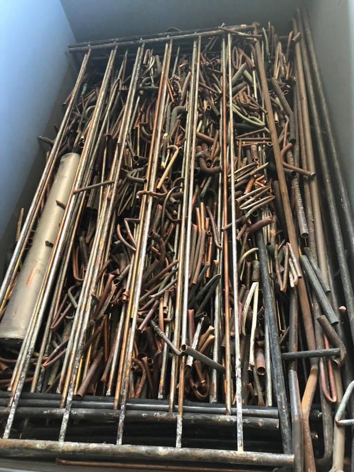 Pile Of Rusty Metal Rods And Tubes Within A Metal-framed Enclosure — H&H Metal Recycling in Bells Creek, QLD
