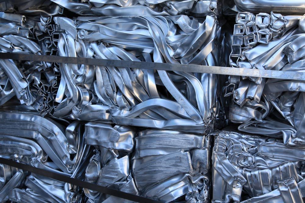 A Pile of Scrap Metal Is Stacked on Top of Each Other — H & H Metal Recycling In Kunda Park, QLD