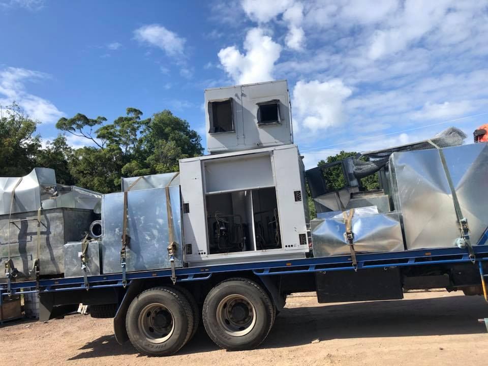 Truck Bed Loaded With Industrial Air Conditioning Units, Outdoors, Sunny Day — H&H Metal Recycling in Mudjimba, QLD