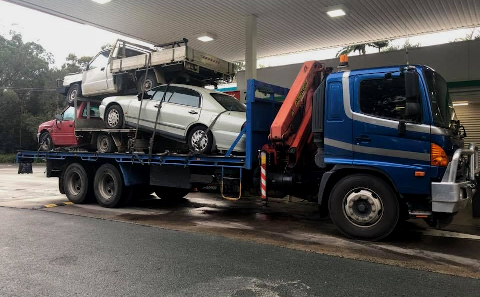 A Pile of Wrecked Cars Are Stacked on Top of Each Other — H & H Metal Recycling In Coolum, QLD