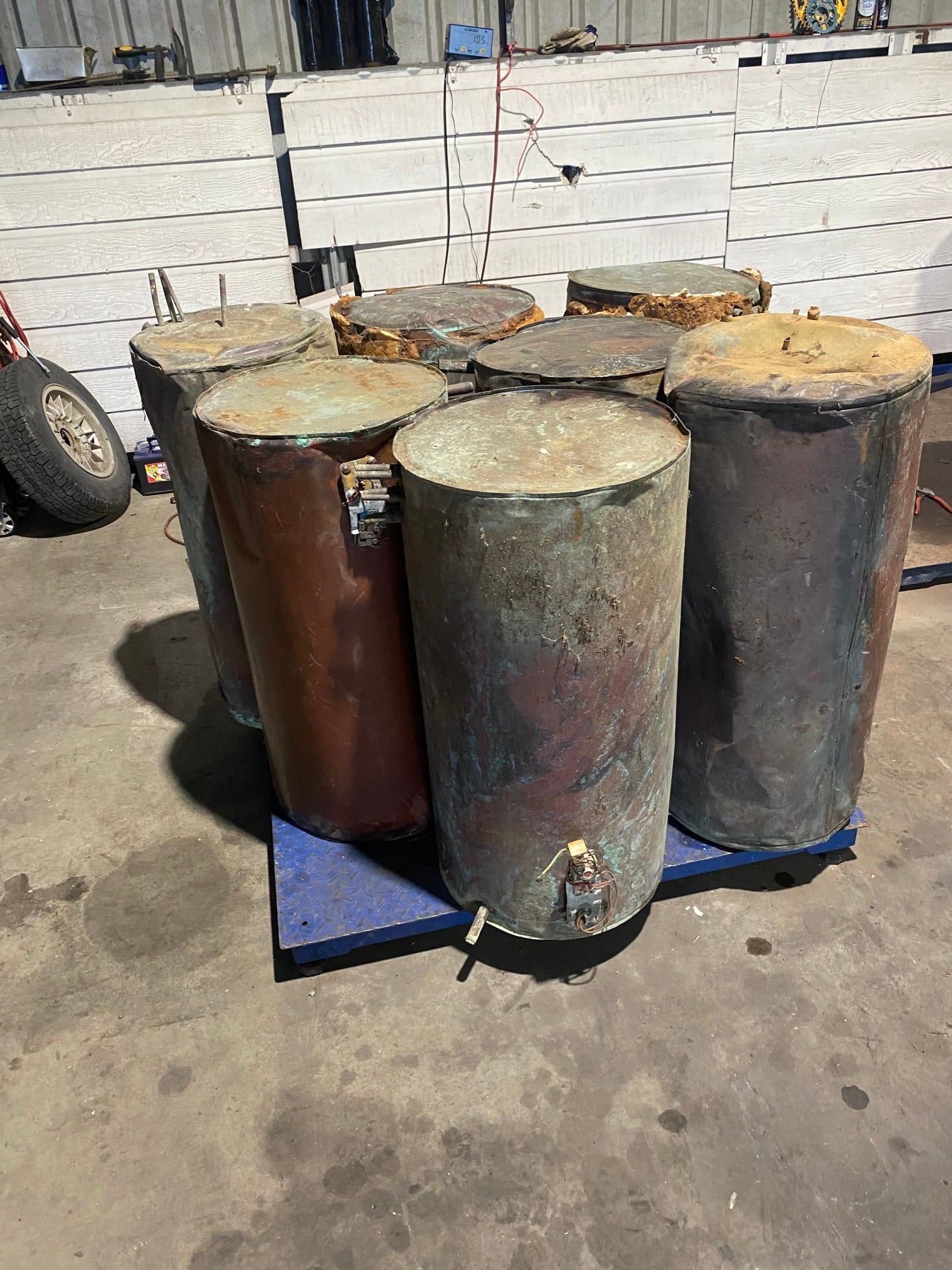 Six Cylindrical Metal Water Heaters or Tanks — H&H Metal Recycling in Mudjimba, QLD