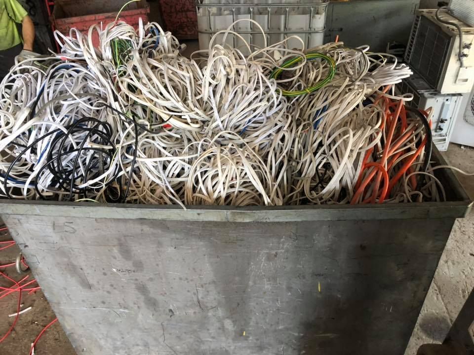 A Bin Overflowing With Tangled Electrical Wires Of Various Colors, Near Other Junk — H&H Metal Recycling in Beerwah, QLD