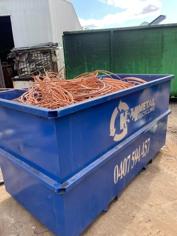 Blue Dumpster Filled With Discarded Air Conditioner Coils — H&H Metal Recycling in Caloundra West, QLD