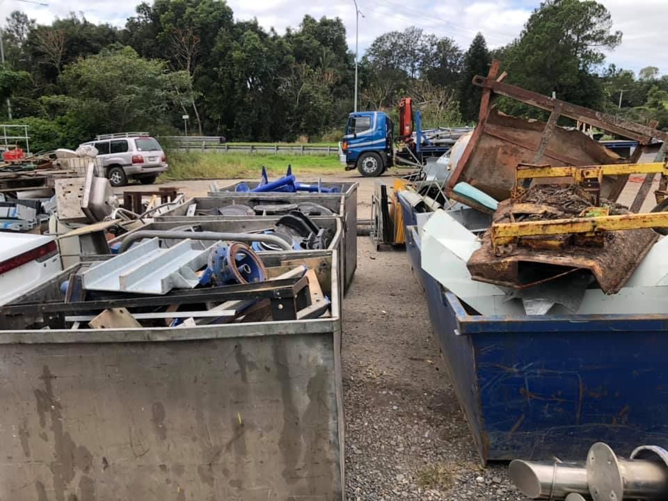 Scrap Metal Yard With Containers Filled With Metal Pieces — H&H Metal Recycling in Beerwah, QLD