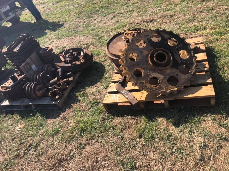 Two Pallets On Grass With Heavy Machinery Parts — H&H Metal Recycling in Glass House Mountains, QLD