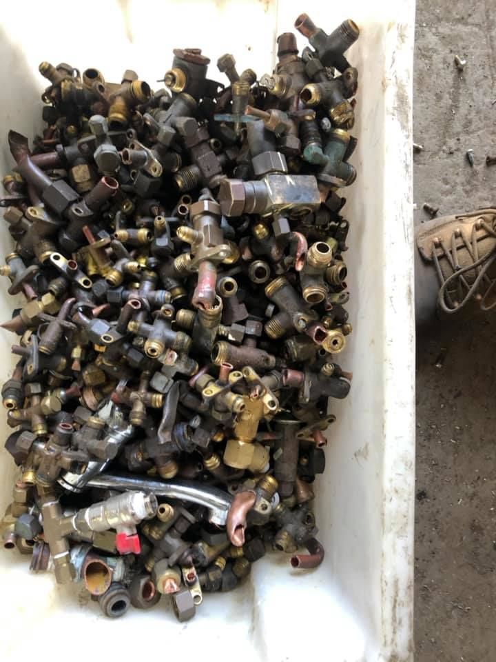 Pile Of Plumbing Valves In A White Bin — H&H Metal Recycling in Glass House Mountains, QLD