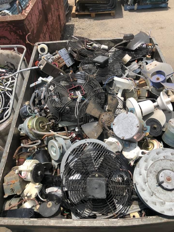Metal Bin Overflowing With Disassembled Fans — H&H Metal Recycling in Glass House Mountains, QLD