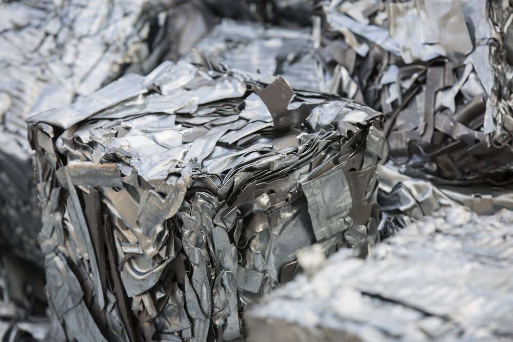 A Pile of Scrap Metal Is Sitting on Top of Each Other — H & H Metal Recycling In Cooroy, QLD