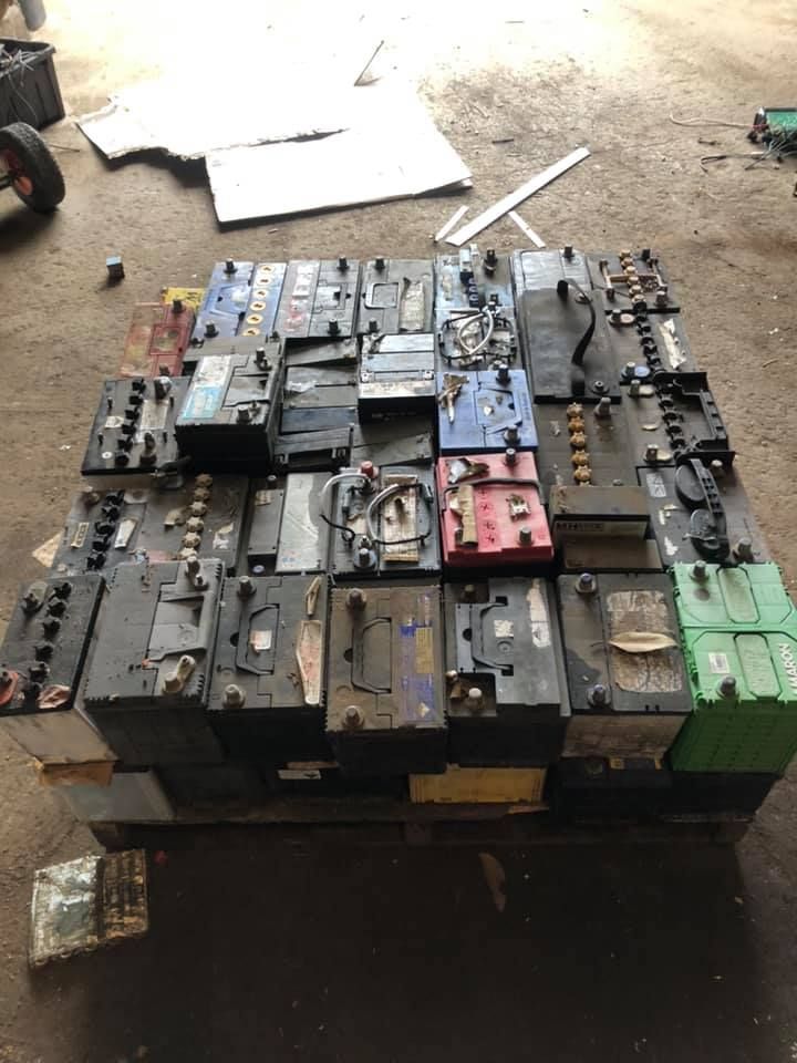 A Pallet Stacked With Multiple Used Car Batteries — H&H Metal Recycling in Caloundra West, QLD
