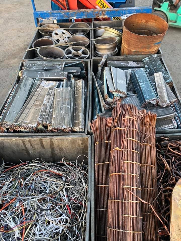 Metal Scrap Separated In Bins, Including Rims, Wire Bundles, And Sheet Metal — H&H Metal Recycling in Caloundra West, QLD