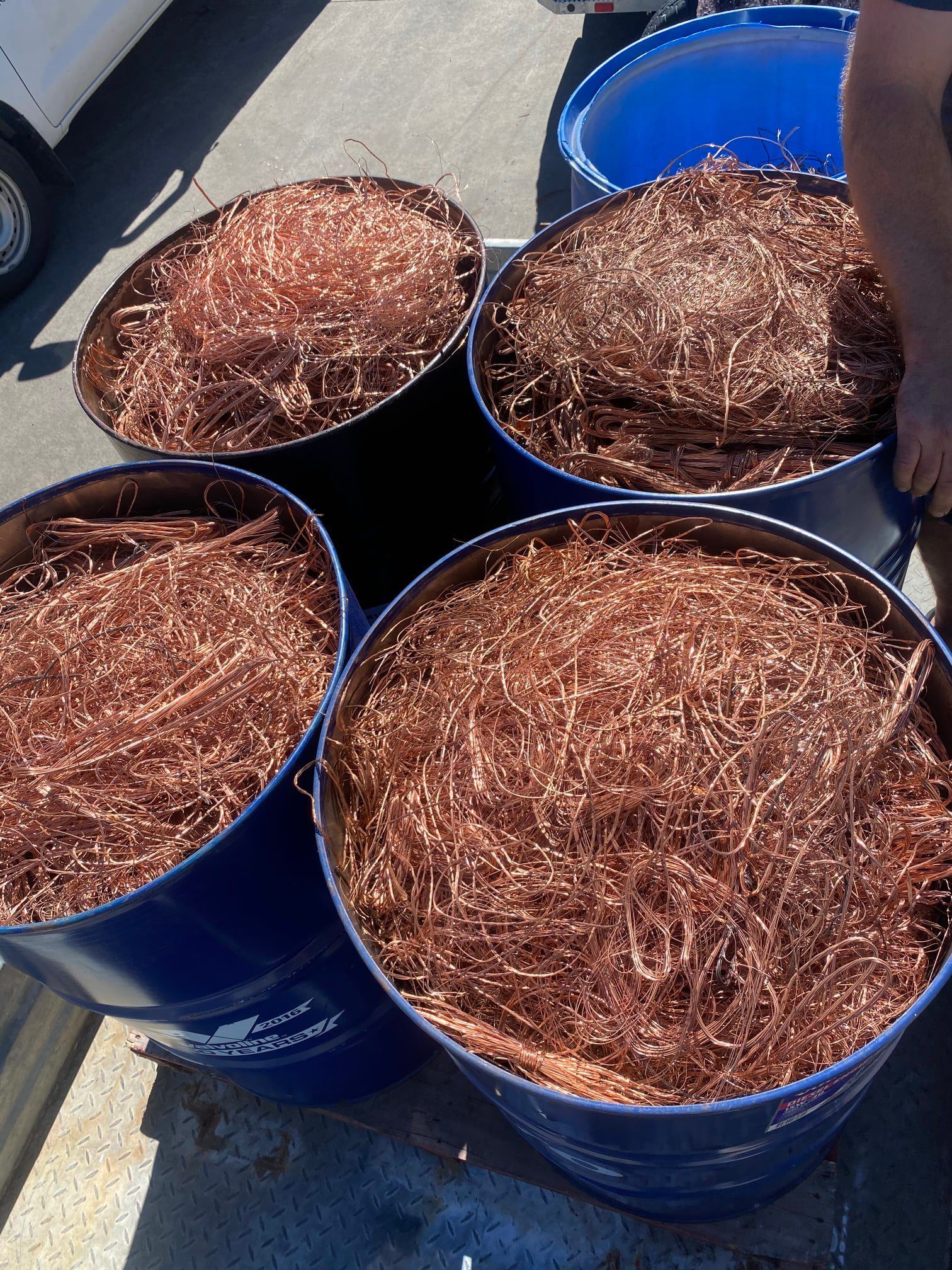 Four Blue Barrels Filled With Copper Wire Scrap — H&H Metal Recycling in Gympie, QLD