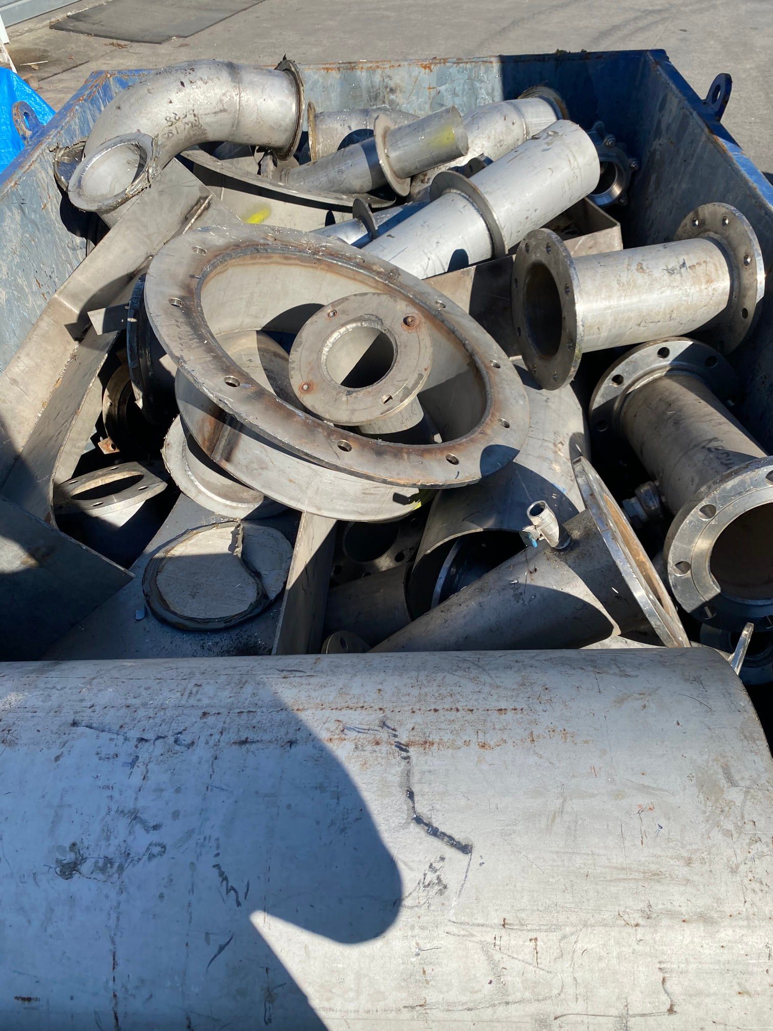 Scrap Metal Bin Overflowing With Discarded Silver Pipes — H&H Metal Recycling in Gympie, QLD