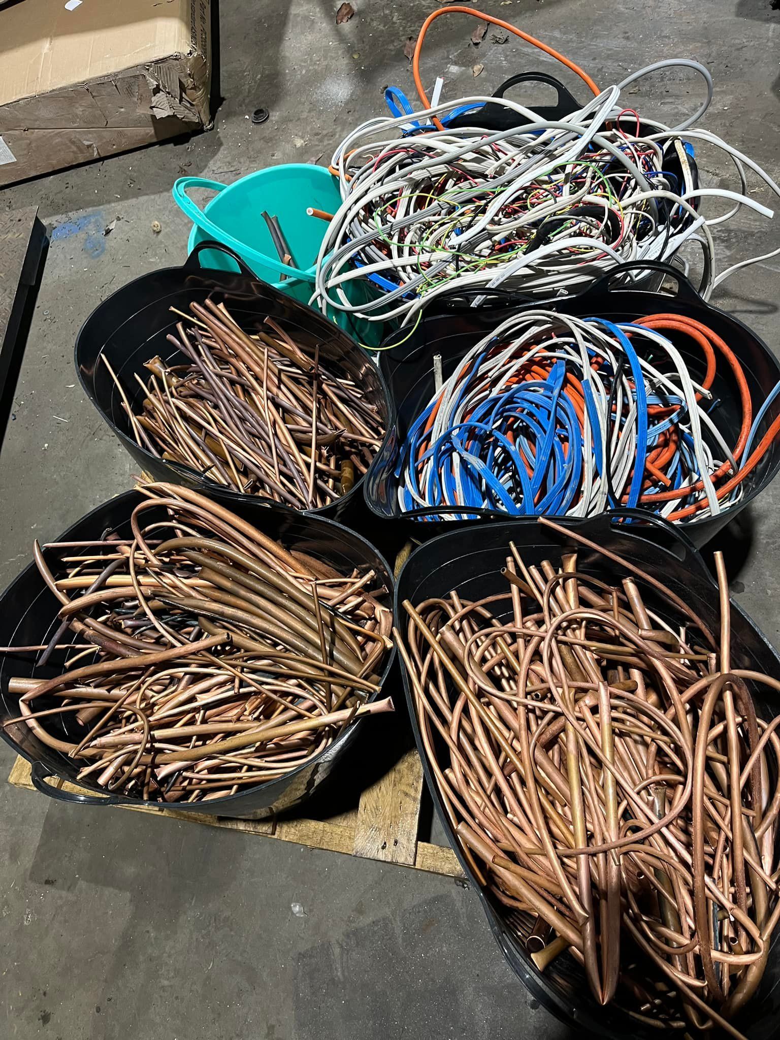 Black Tubs Filled With Assorted Copper And Wires