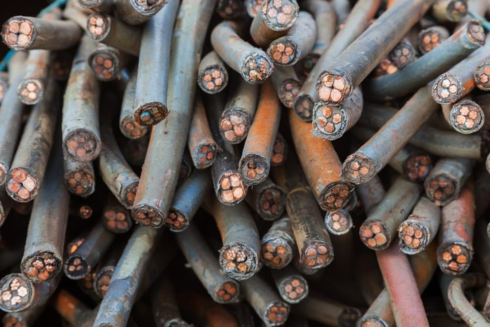 A Pile of Copper Wire Is Sitting on Top of Each Other — H & H Metal Recycling In Kunda Park, QLD