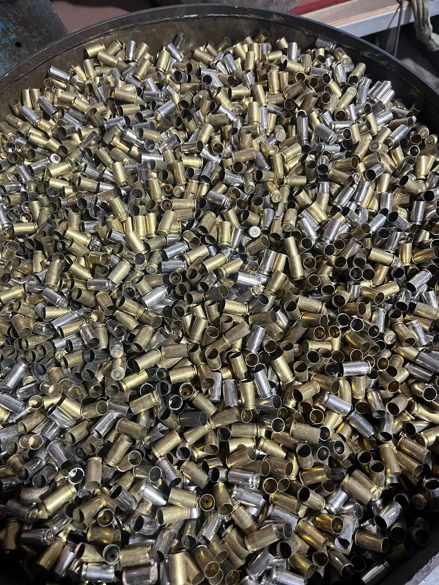 Container Filled With Mixed Brass And Silver Casings