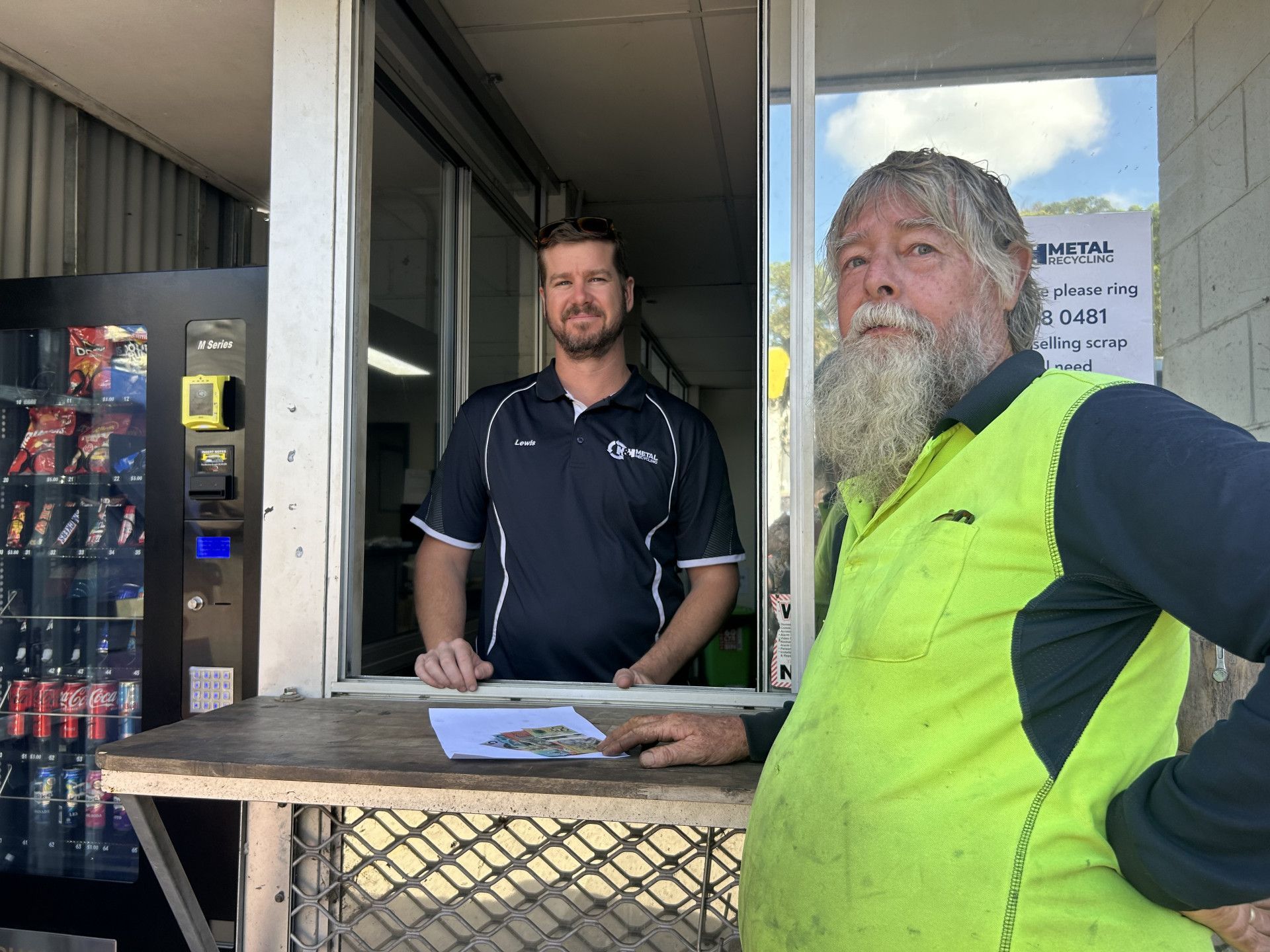 Customer Receiving Cash After Sale — H & H Metal Recycling In Kunda Park, QLD