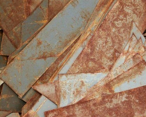 A Pile of Rusty Metal Pieces Stacked on Top of Each Other — H & H Metal Recycling In Kunda Park, QLD