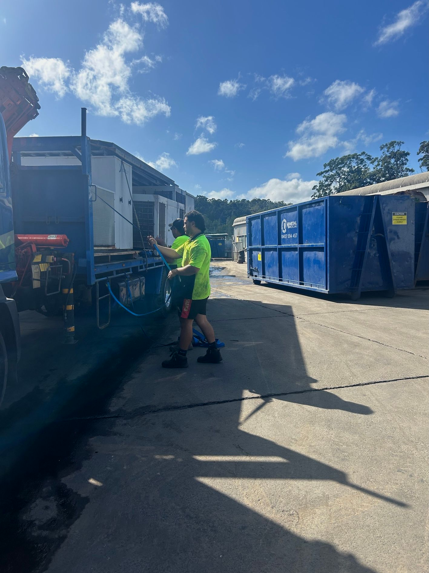 Workmen Offloading Old Whitegoods For Recycling — H & H Metal Recycling In Kunda Park, QLD