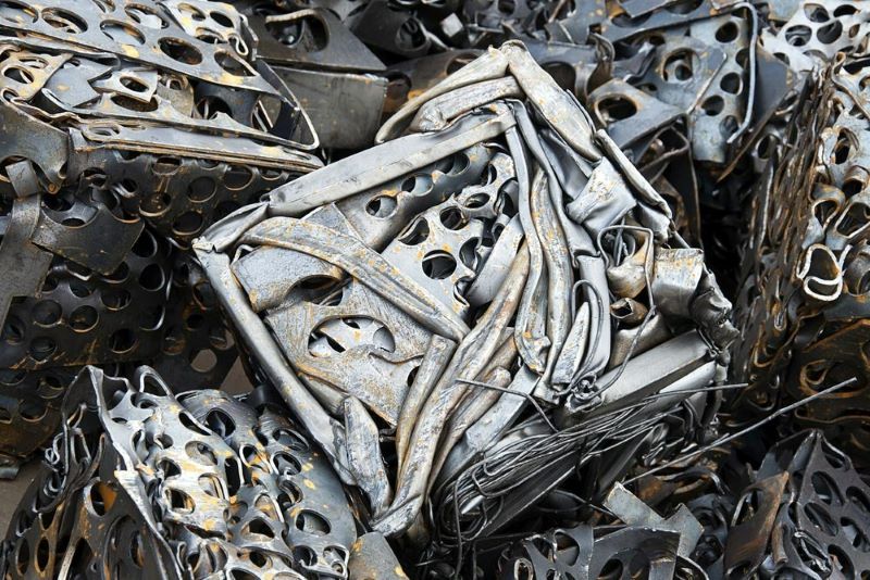 A Pile of Scrap Metal Is Stacked on Top of Each Other — H & H Metal Recycling In Warana, QLD