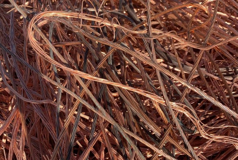 A Pile of Copper Wire Is Laying on The Ground — H & H Metal Recycling In Kunda Park, QLD